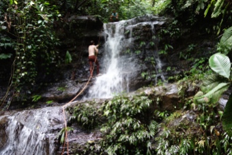 Volunteers go on the repelling waterfall hike