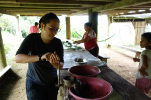 Volunteers make chocolate with Don Adrian and his family