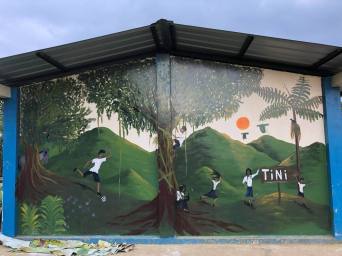 Volunteers painted a mural at the local school